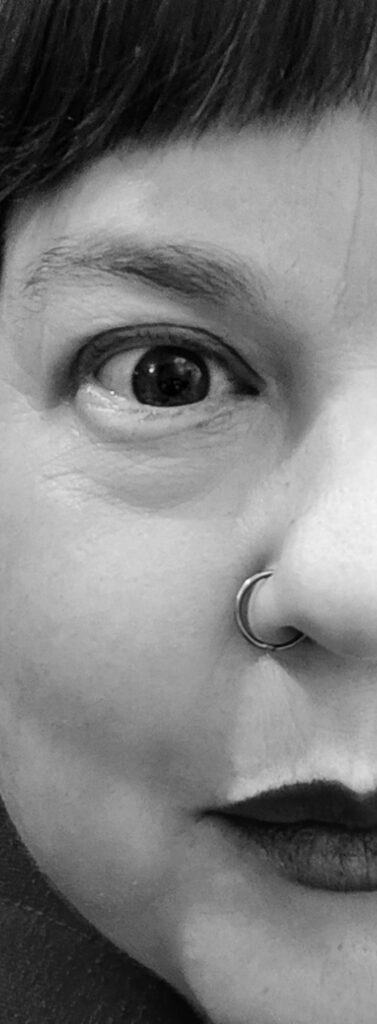 Black and white image of half of a person's face.